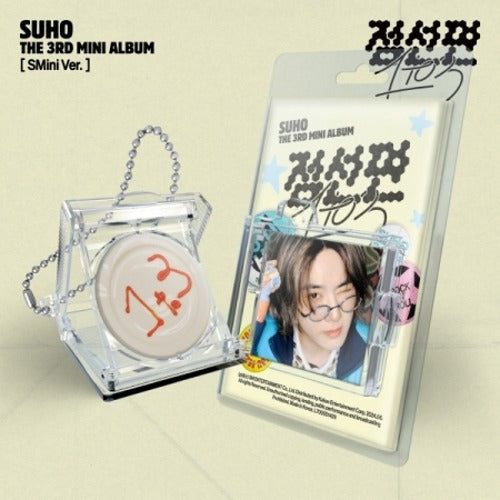 An image of SUHO's 3rd mini album '1 to 3' deluxe version packaging, showing a clear plastic case, a photocard, and a keyring ball chain.