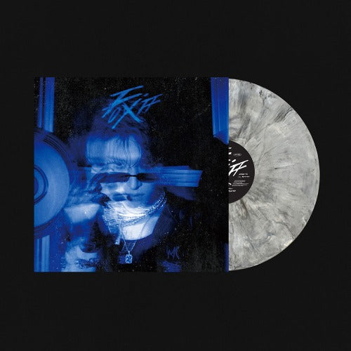 Vinyl record with a cover featuring a person and blue text on a black background