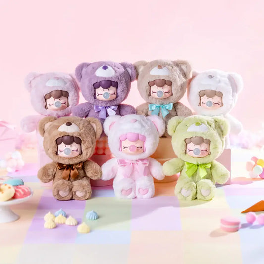 Set of colorful plush toys with cartoon faces on a pastel background
