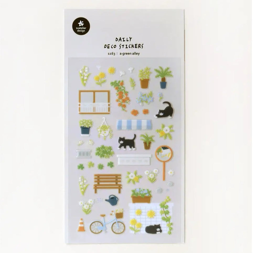 A sticker sheet with a green alley theme, featuring various illustrations including plants, animals, and home decor items.