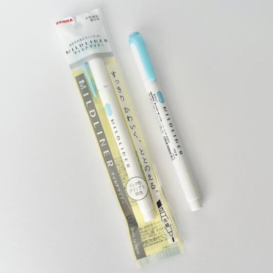 Zebra mildliner pen with packaging on a light gray background