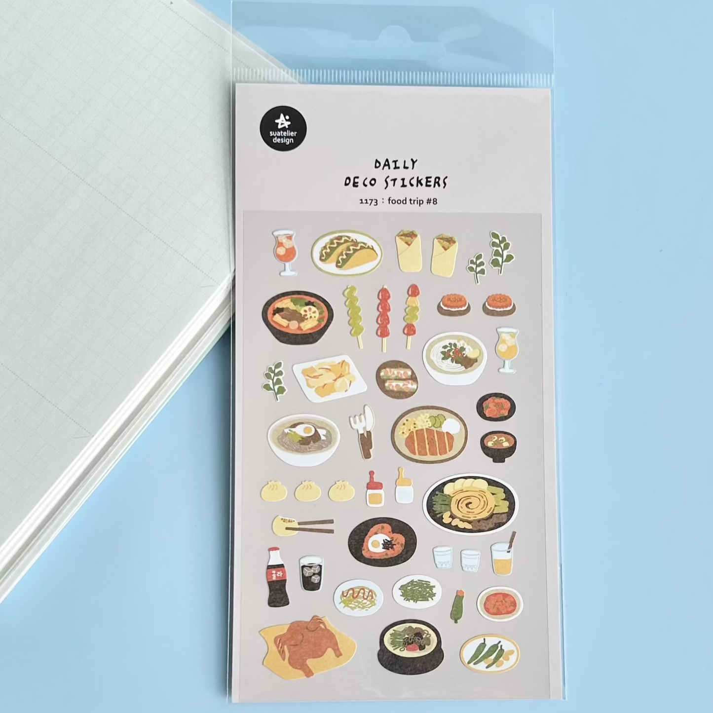 Packaging of Daily Deco Stickers with food-themed illustrations on a light blue background