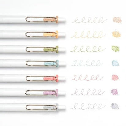 Set of pens with metallic clips on a white background