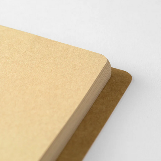Two beige notebooks on a light gray background