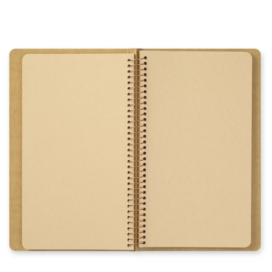 Open notebook with beige cover and interior on a white background