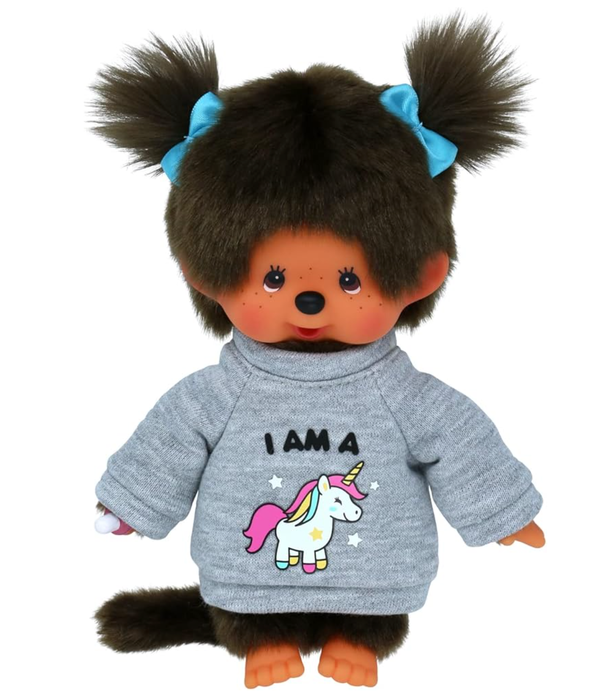 A Monchhichi Girl Plush Doll with a unicorn sweater and blue hair ribbons.