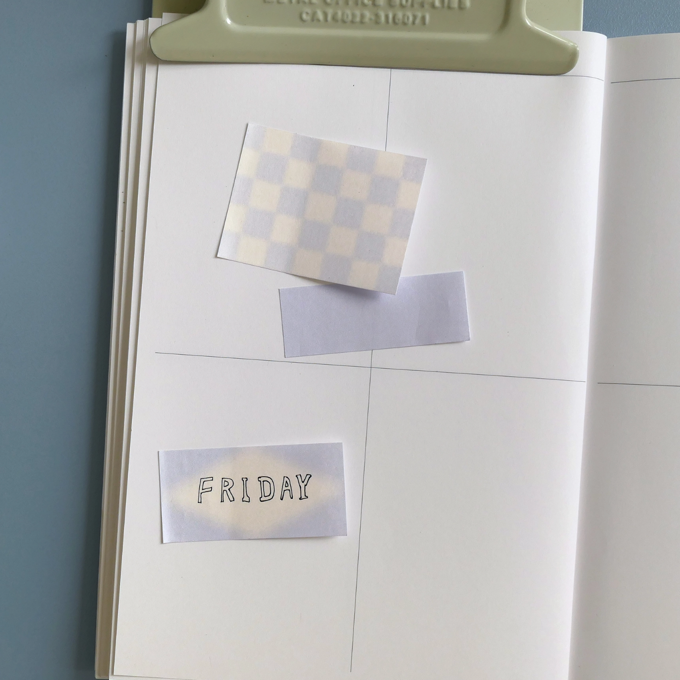 Open book with decorative sticky notes on a gray background