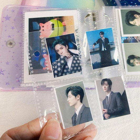 Collection of photos in a transparent photo album held by a hand.