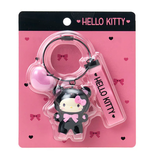 Hello Kitty keychain on pink packaging with 'Hello Kitty' branding.
