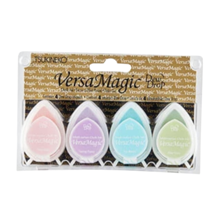TSUNOMOI VersaMagic Dip Pen ink pad set in clear plastic packaging with a brown branded header card. The set includes four teardrop-shaped pens in pastel pink, lavender, light blue, and light green.