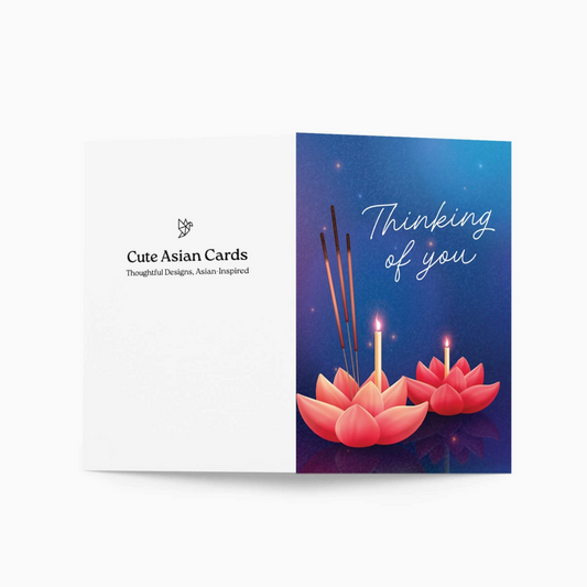 A folded greeting card shown against a light gray background. The left panel is white with the text 'Cute Asian Cards' and a small logo.