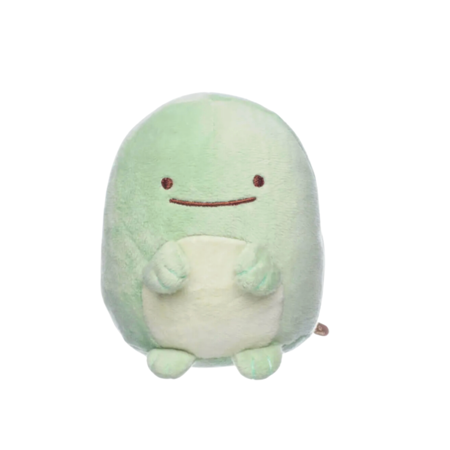 Plush toy with a light green body and white belly on a white background