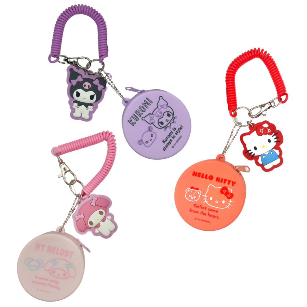 Set of colorful keychains with cartoon characters on a white background
