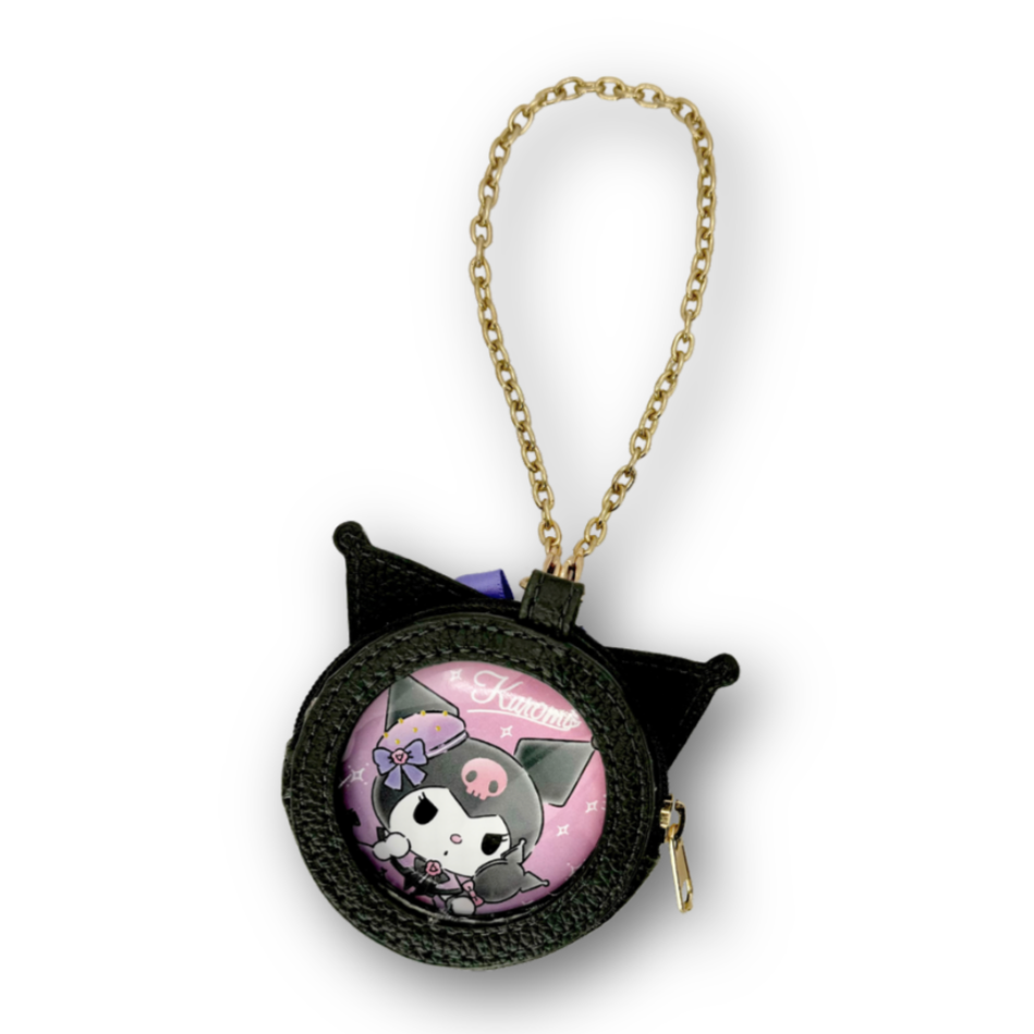 Black pouch charm with a character design on a white background