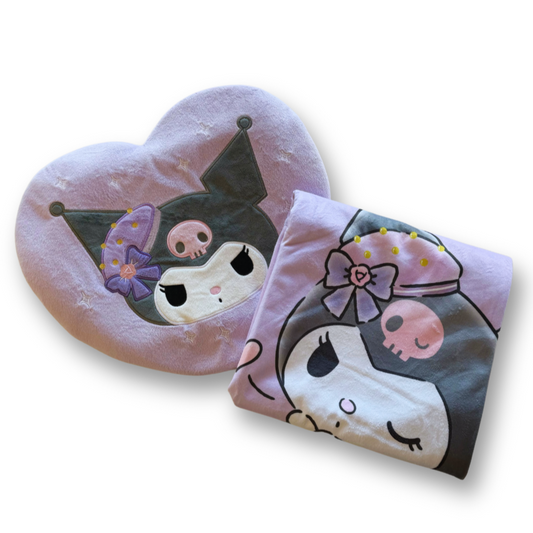 Heart-shaped pillow and matching pouch with cartoon character design on a white background