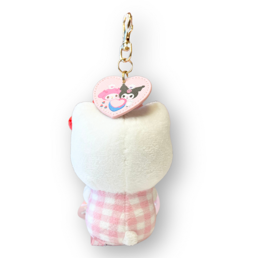Plush keychain with a heart-shaped tag on a white background