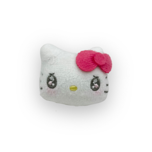 Plush toy with a pink bow on a white background