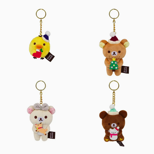 Four plush keychain blind boxes featuring the character Rilakkuma in different colors and holiday-themed accessories.