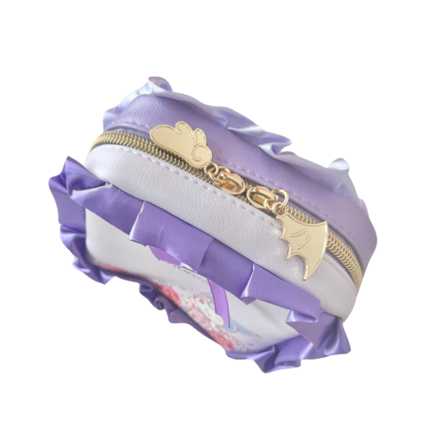 Purple and white cosmetic bag with gold zipper and heart-shaped charms on a white background