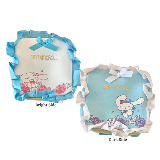 Two Cinnamoroll-themed products with blue and white ribbons on a white background