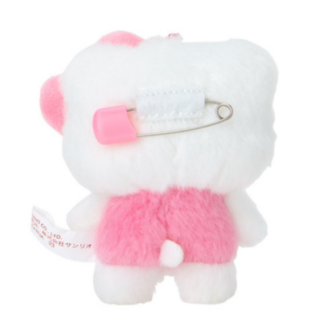 White plush toy with pink accents on a white background