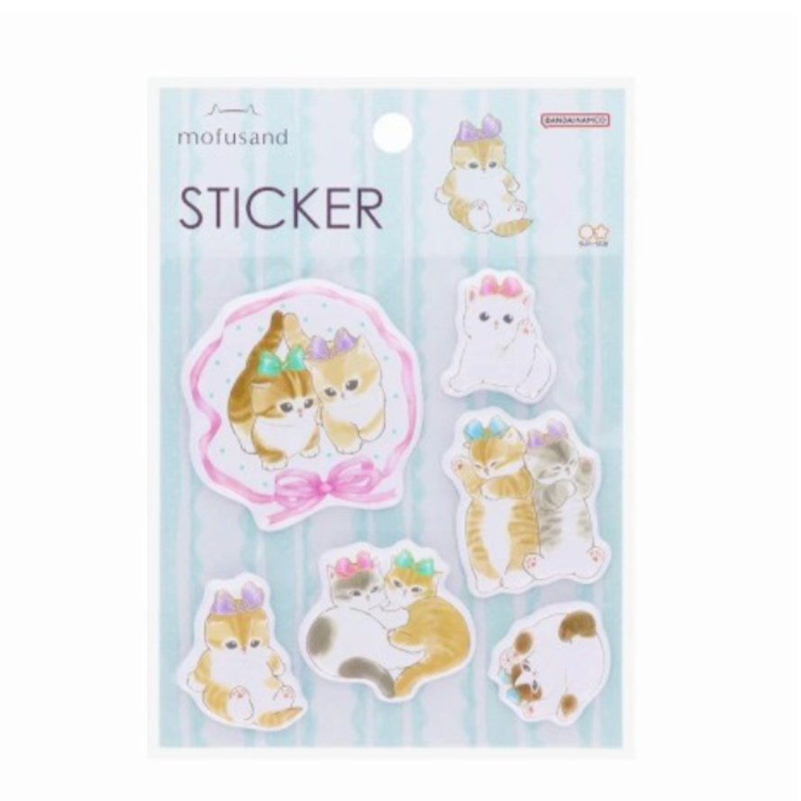 A sheet of stickers featuring cartoon cats with ribbon accessories, displayed against a blue background.