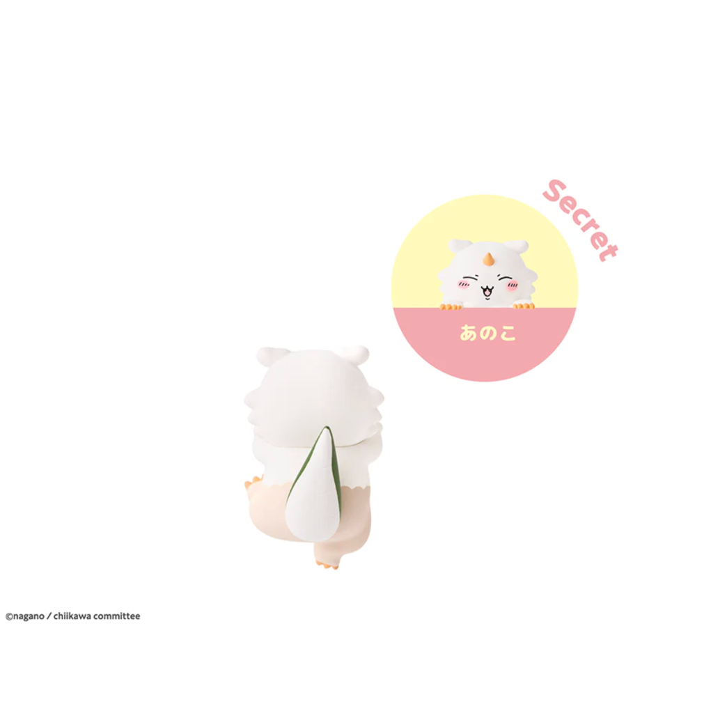 Small white creature with a yellow circle featuring a cartoon cat and text on a white background