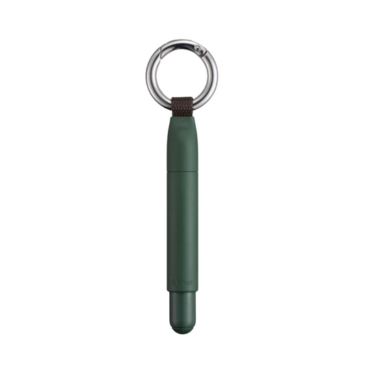 A dark green pen-style device with a silver metal key ring and a small dark brown loop, shown vertically on a plain white background.
