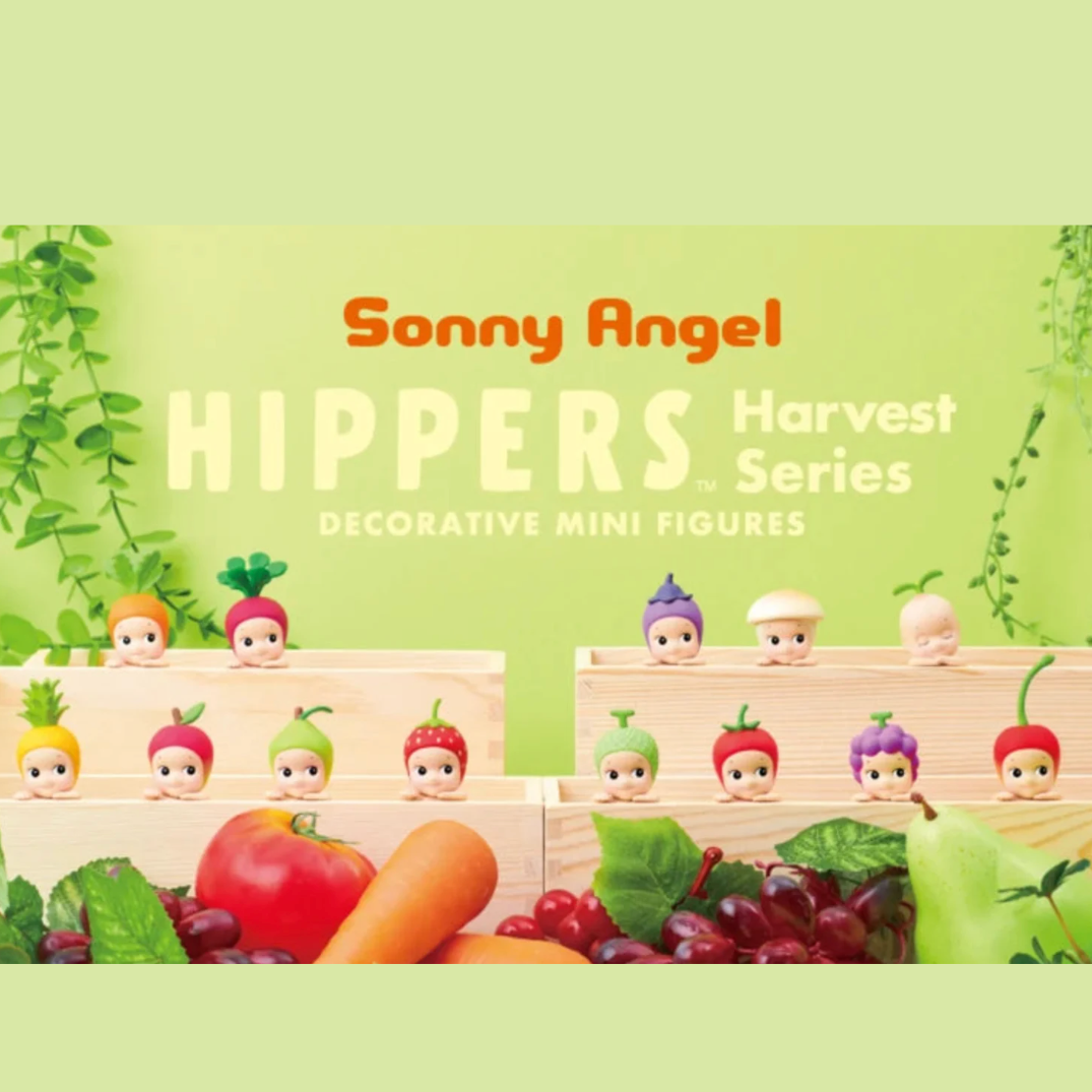Sonny Angel Hippers Harvest Series decorative mini figures displayed in wooden crates with fruits and vegetables, on a light green background with product text.