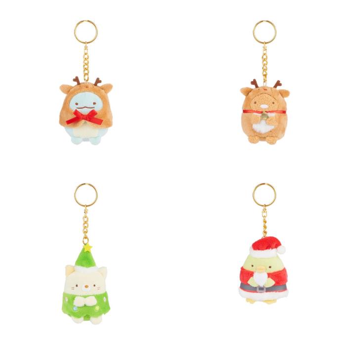 Four plush keychains featuring cute, festive characters including a reindeer, a snowman, a Christmas tree, and Santa Claus.
