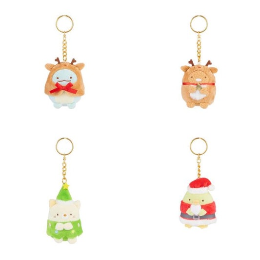 Four plush keychains featuring cute, festive characters including a reindeer, a snowman, a Christmas tree, and Santa Claus.