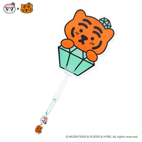 Fan with cartoon tiger character in a crystal ball with a white background