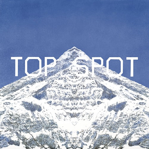 Snowy mountain peak with 'TOP SPOT' text on a blue background