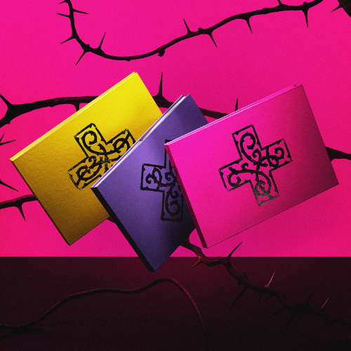Three notebooks with Celtic cross designs on a pink and purple background with thorns.
