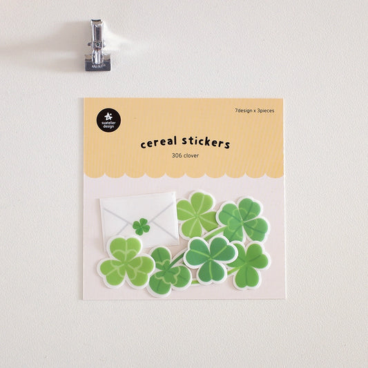 Packaging of clover-shaped cereal stickers with a beige background