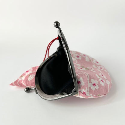 coin pouch shown with clasp open side view in pink color