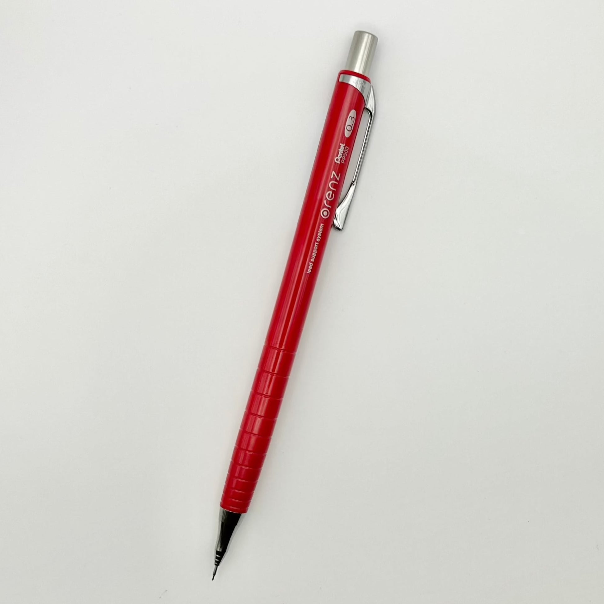 Mechanical pencil shown in red