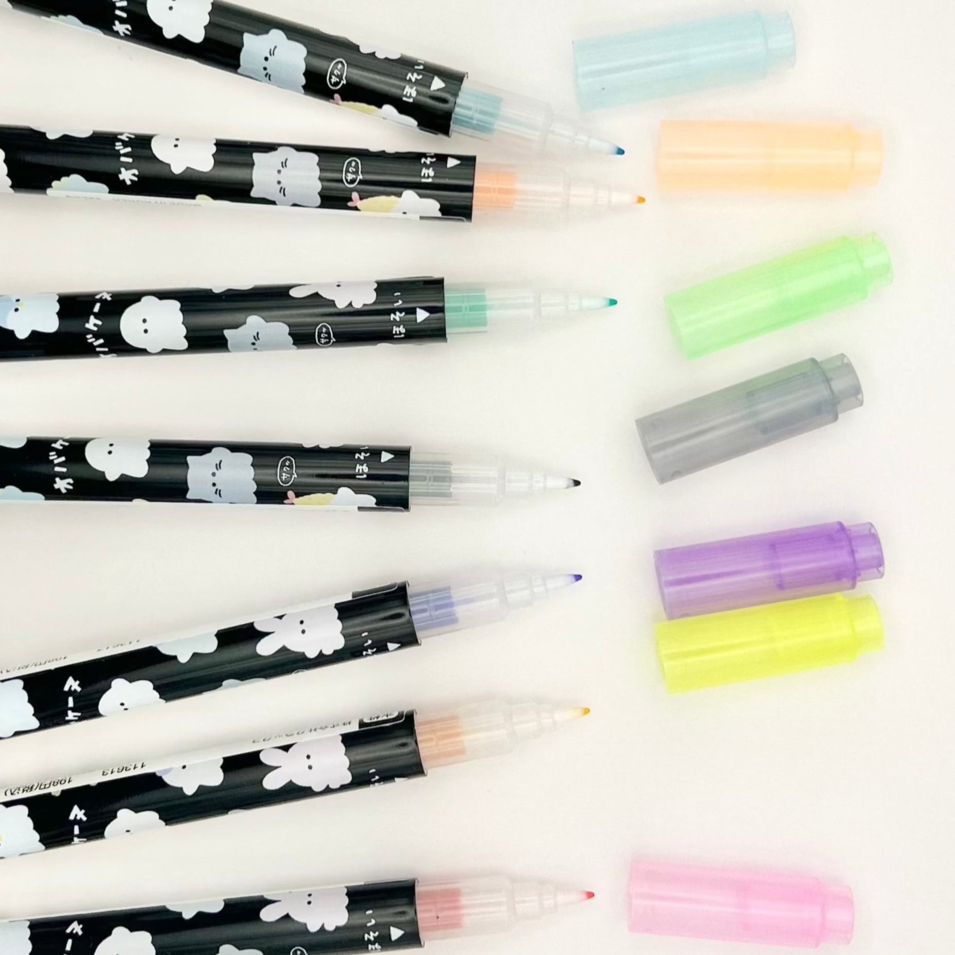 Highlighter pens with cap off to show tip and variety of colors