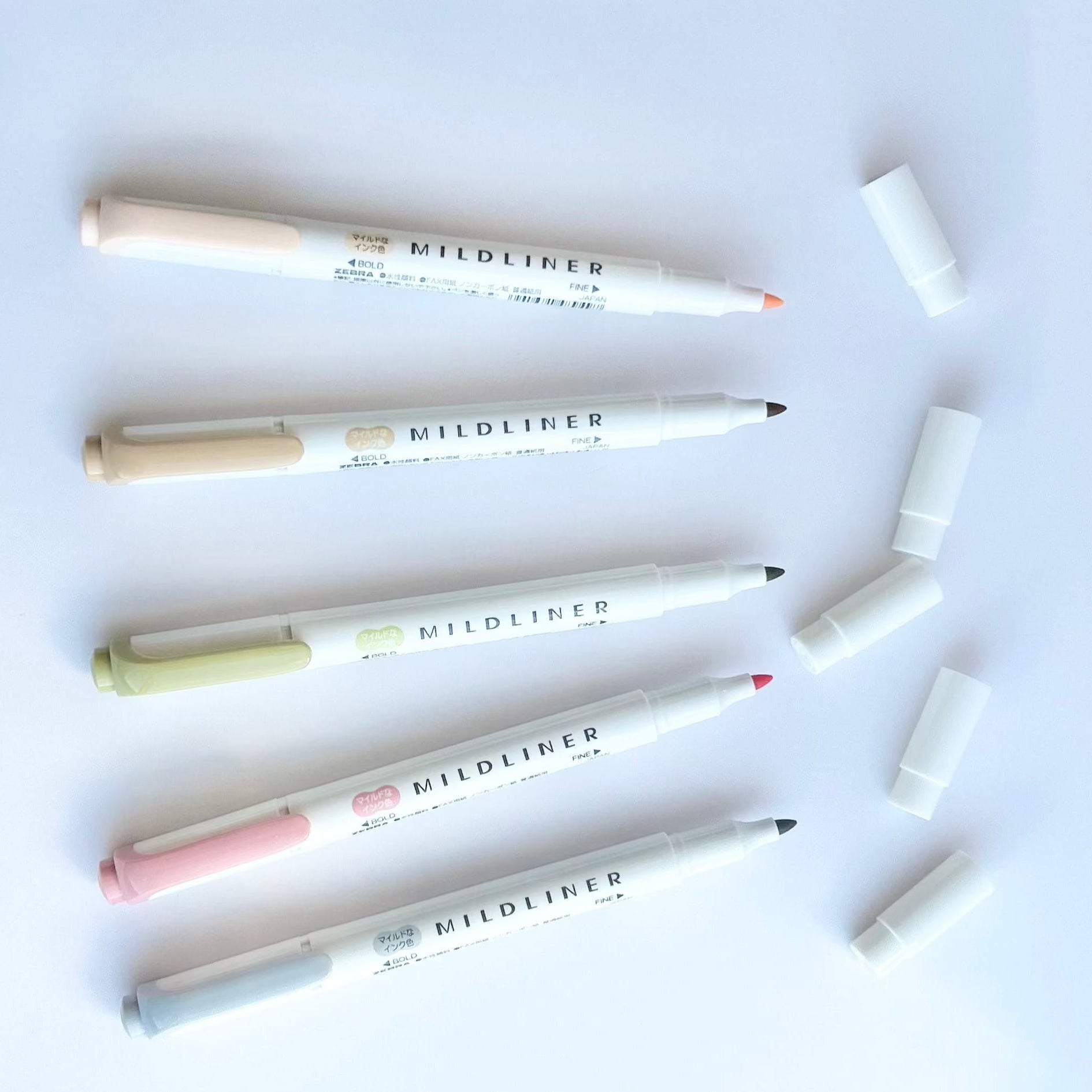 mildliner highlighter open with caps off to show color and tips