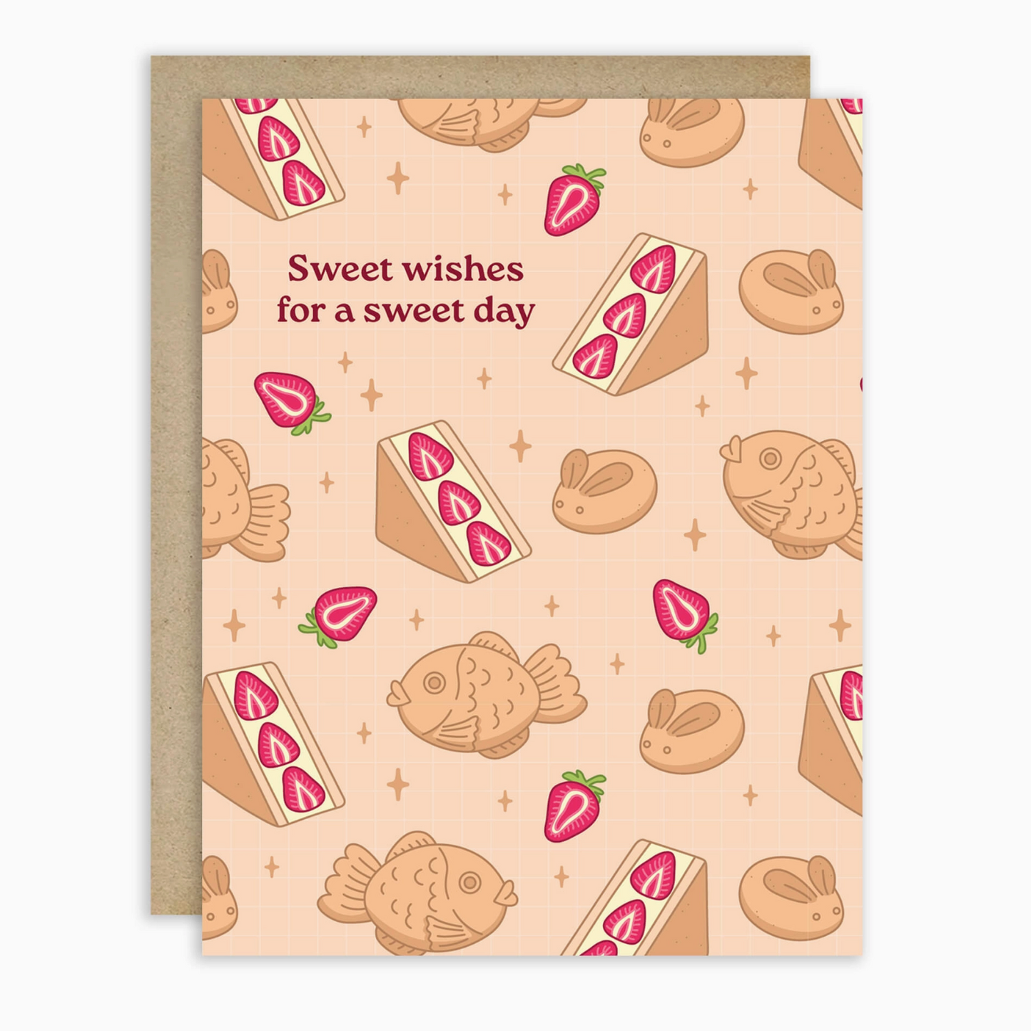 Beige greeting card with sando and taiyaki  illustrations and text 'Sweet wishes for a sweet day' on a white background.
