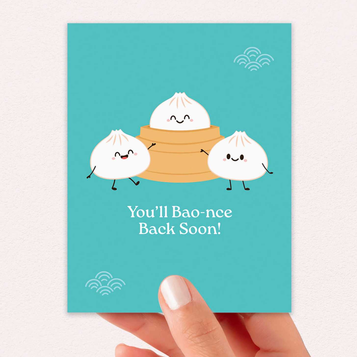 Light Blue card with cartoon buns and text 'You'll Bao-ncе Back Soon!' held by a hand on a white background