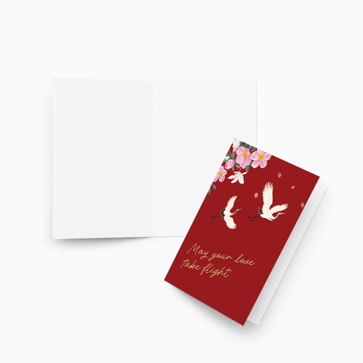 Red card with birds and flowers design on a white background