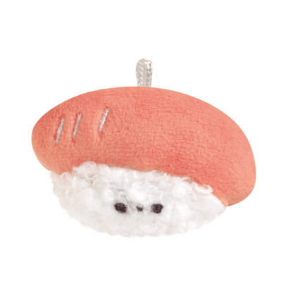 Small plush keychain resembling a sushi with a white filling on a white background