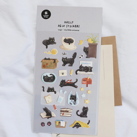Decorative sticker sheet with black cat illustrations on a gray background