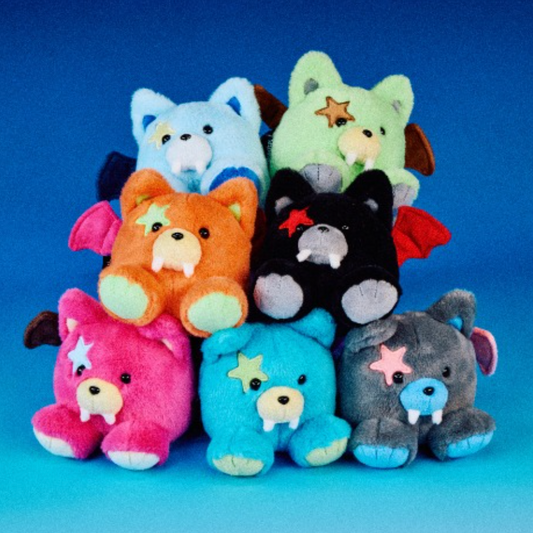 Stack of colorful plush toys on a blue background