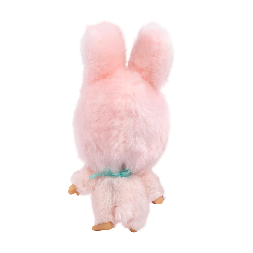 Plush toy resembling a pink rabbit on a white background