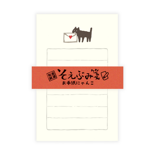 Letter set with cat illustration and text on a white background