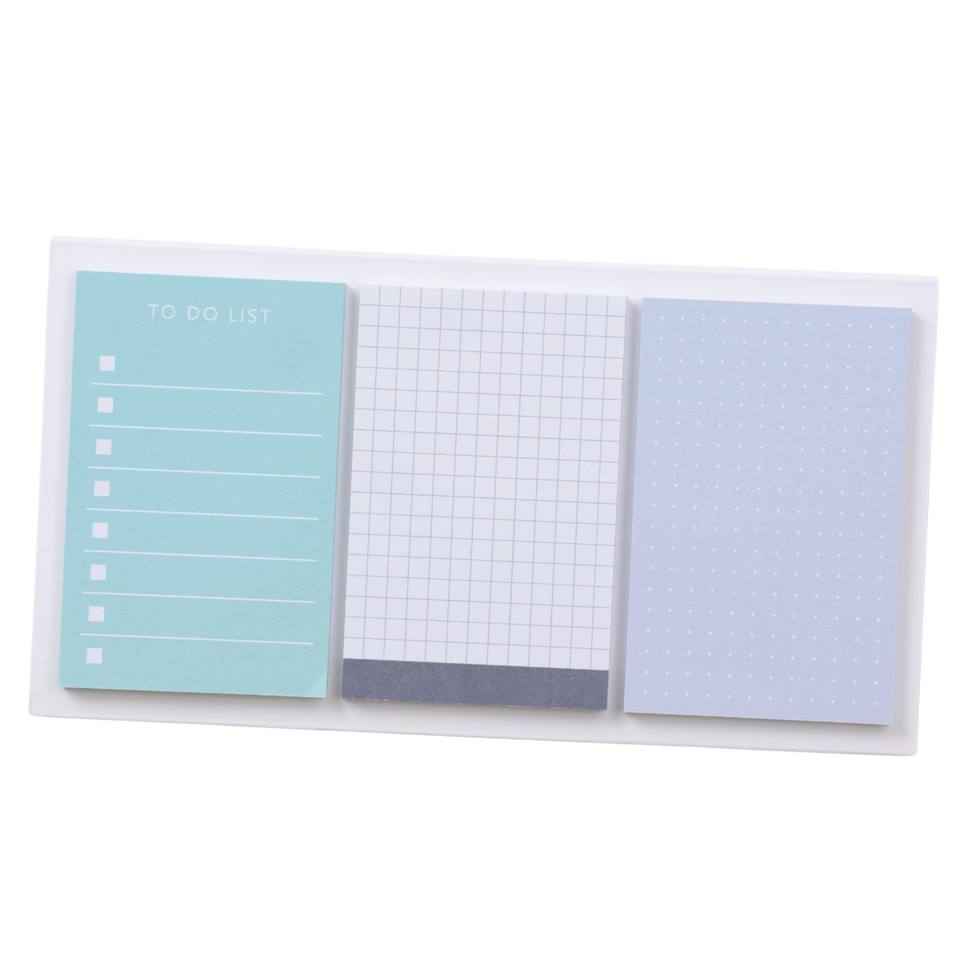 Set of three small notebooks with different designs on a white background