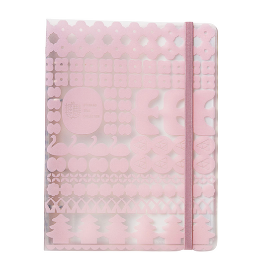 Pink notebook with decorative cut-out patterns on a white background