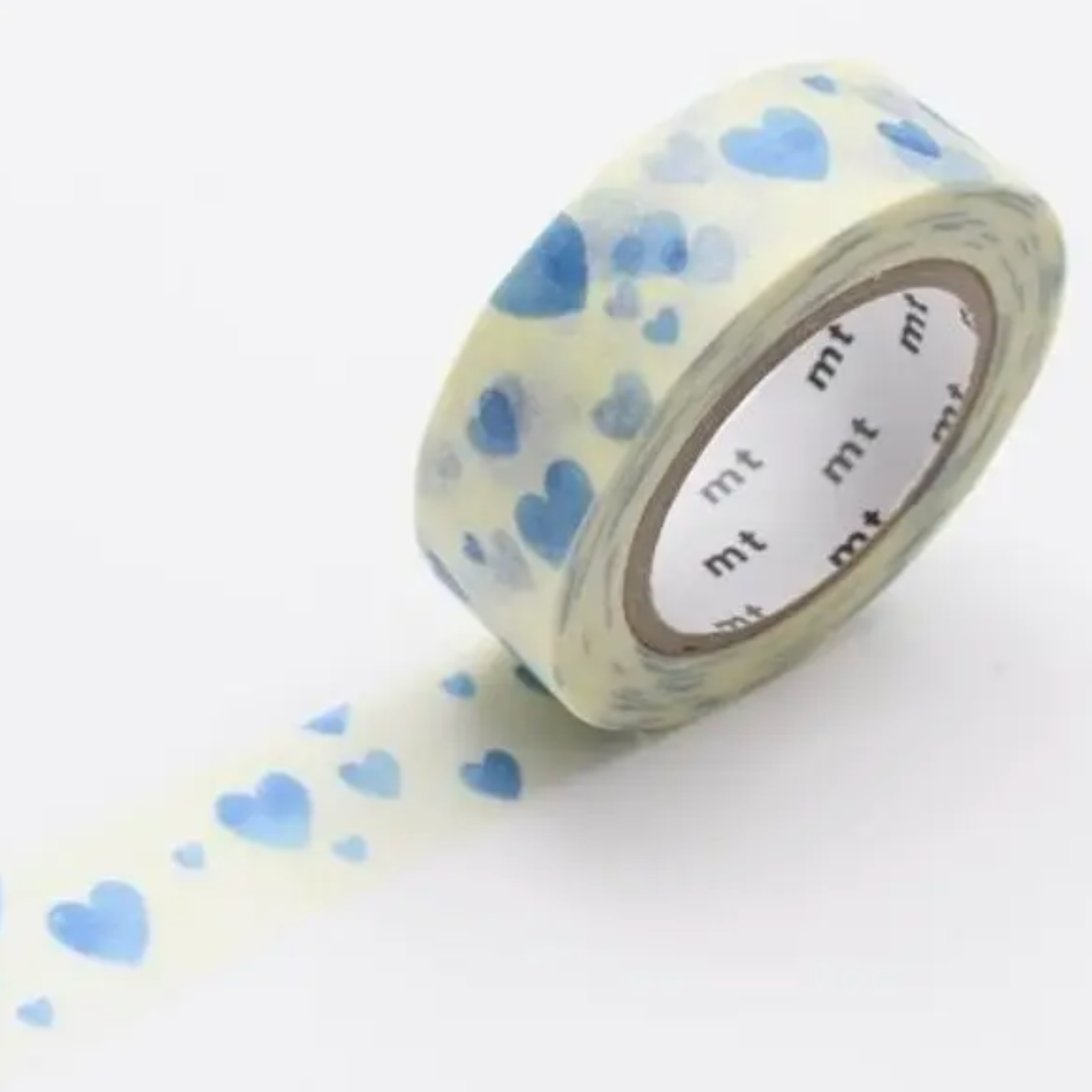 Roll of decorative tape with blue heart pattern on a white background